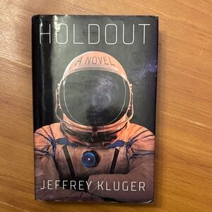 Holdout: A Novel by Jeffrey Kluger - Black and Orange Cover